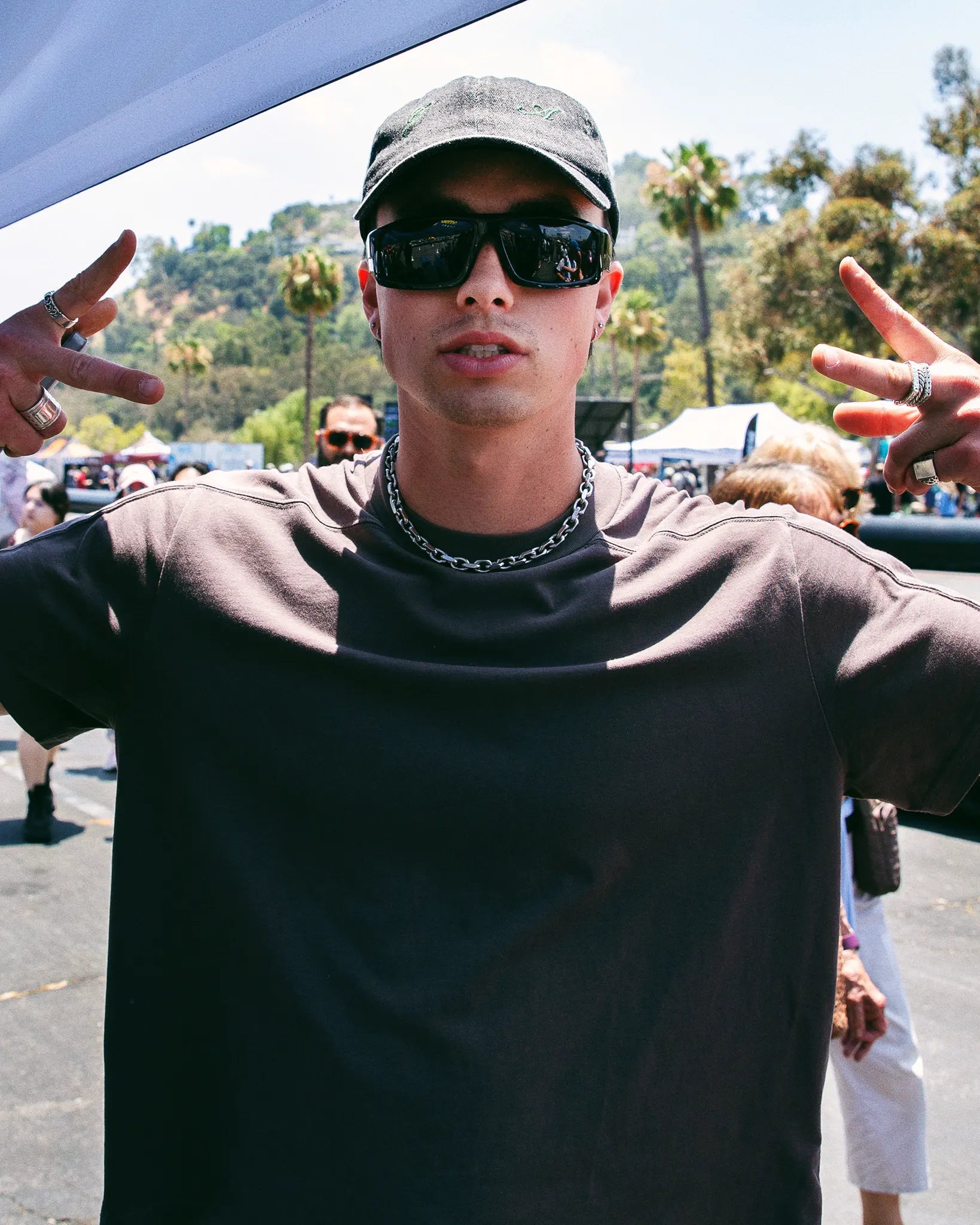 Austin Mollno flashing peace signs in the crowd at SWAGTRON Demo Days.