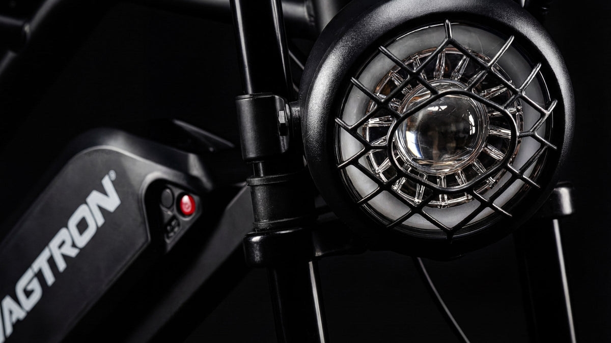 SWAGTRON UrbanCruise caged retro headlight close-up